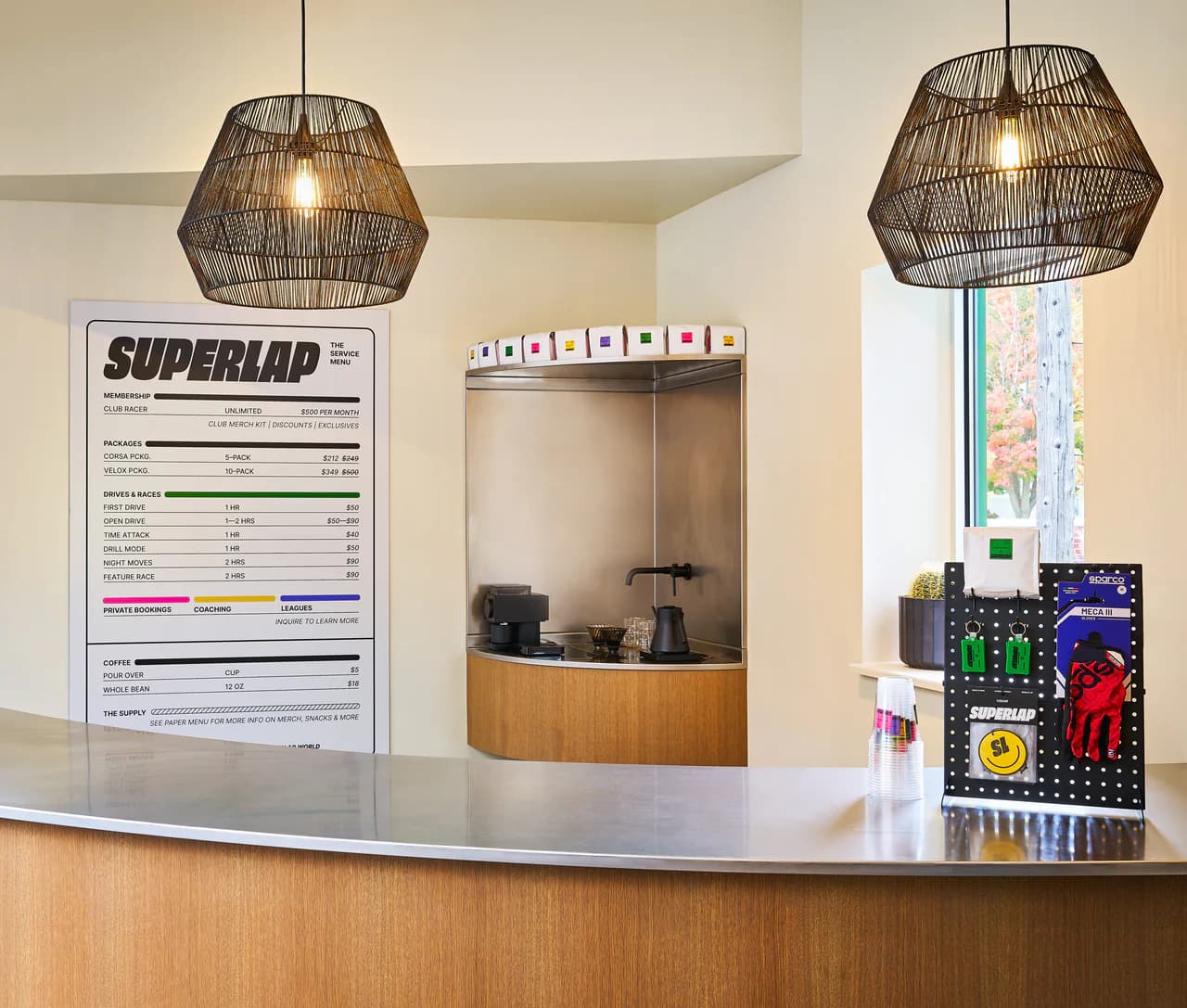 The Superlap front counter with woven pendant lights and a menu board